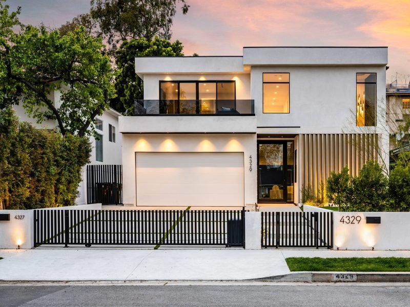 A brightly illuminated house with festive outdoor lights