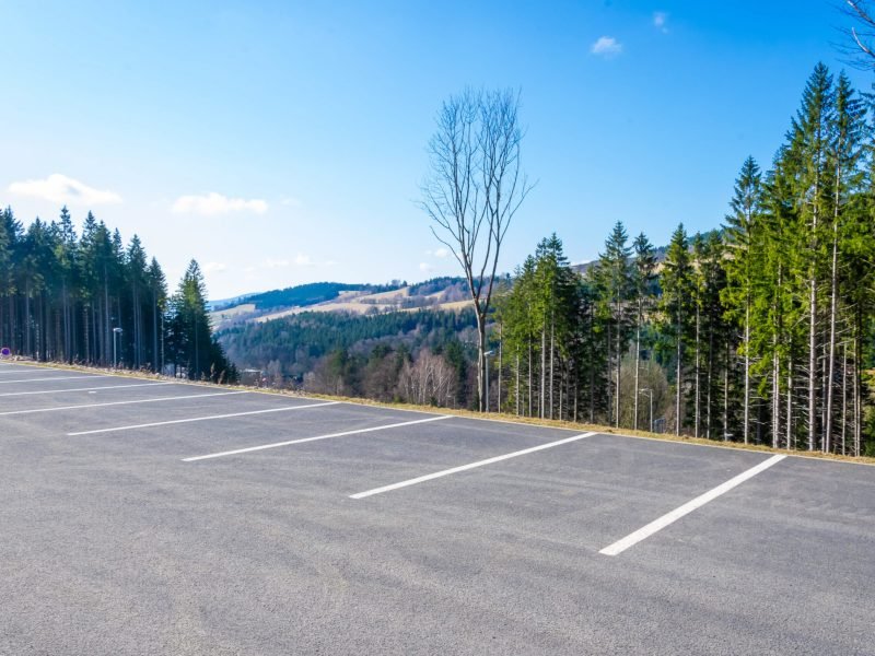 car parking with mountains in the background